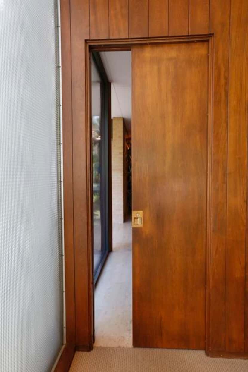 
Many rooms are closed off by pocket doors that can be concealed when open. This detail...