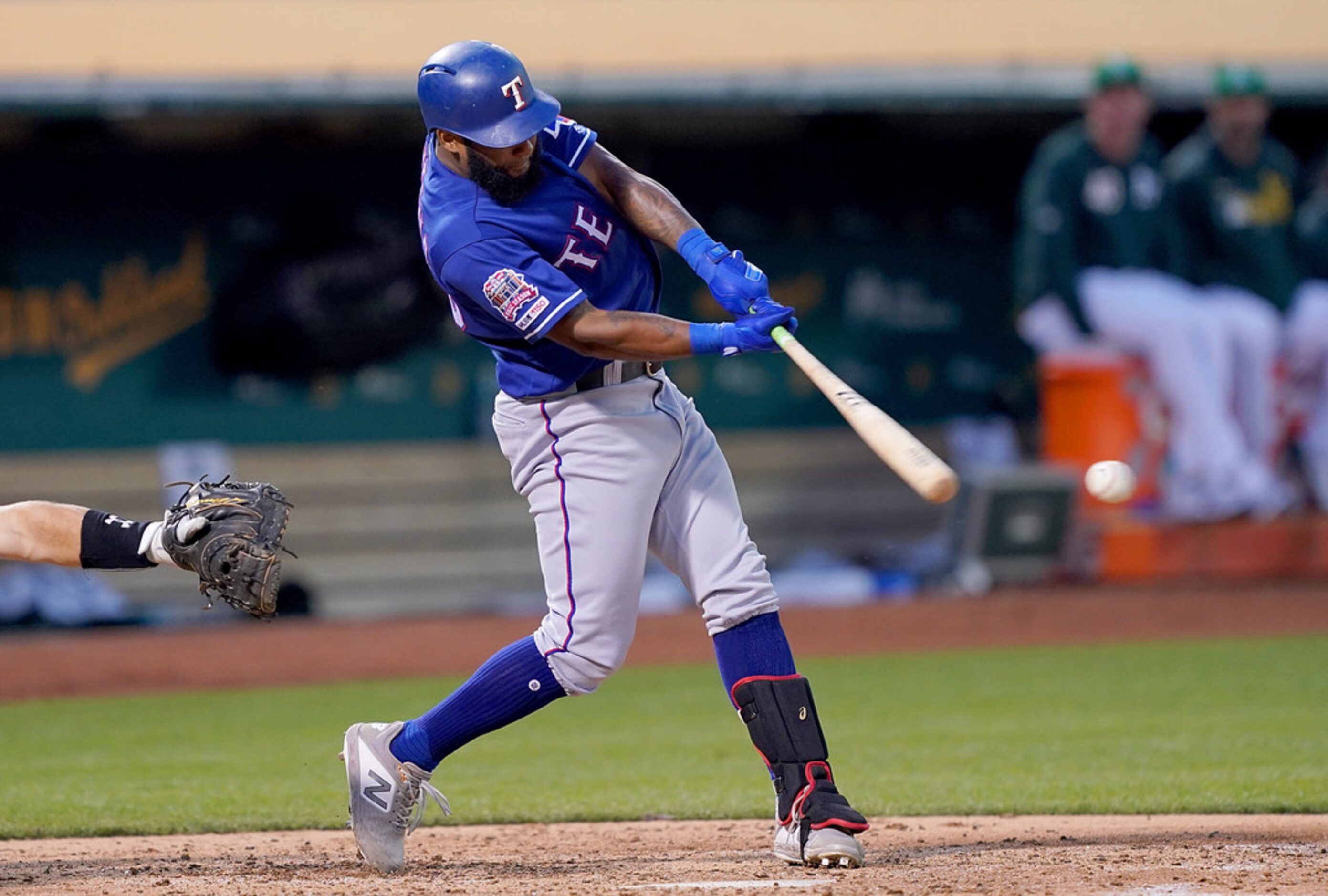 OAKLAND, CA - JULY 25:  Danny Santana #38 of the Texas Rangers hits a base loaded two-run...