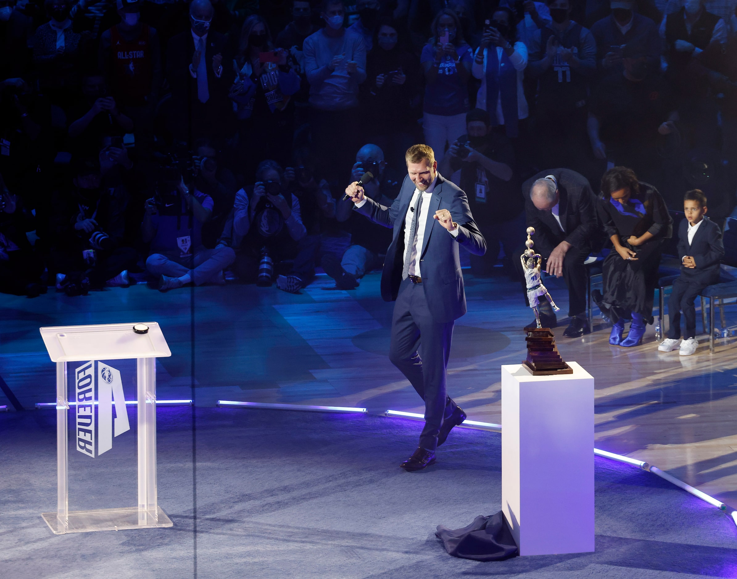 Former Dallas Mavericks player Dirk Nowitzki takes a look at a replica of a statue that will...