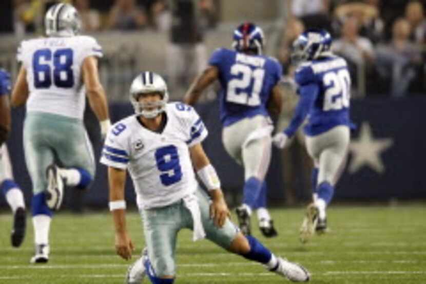 Dallas Cowboys quarterback Tony Romo (9) gathers himself after New York Giants free safety...