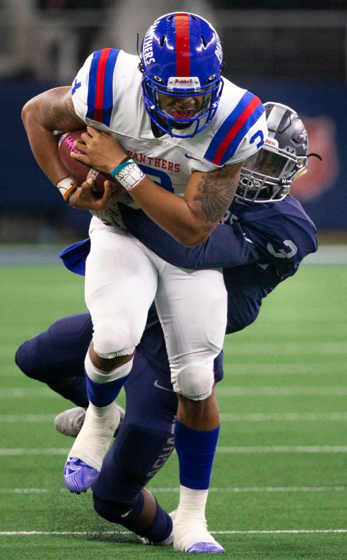 Duncanville quarterback Ja'Quinden Jackson (3) tries to break free from Flower Mound running...