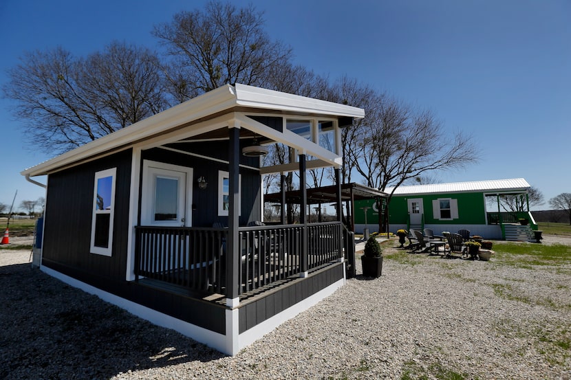 An exterior view of tiny house models at OurCommunity, which is under construction in rural...