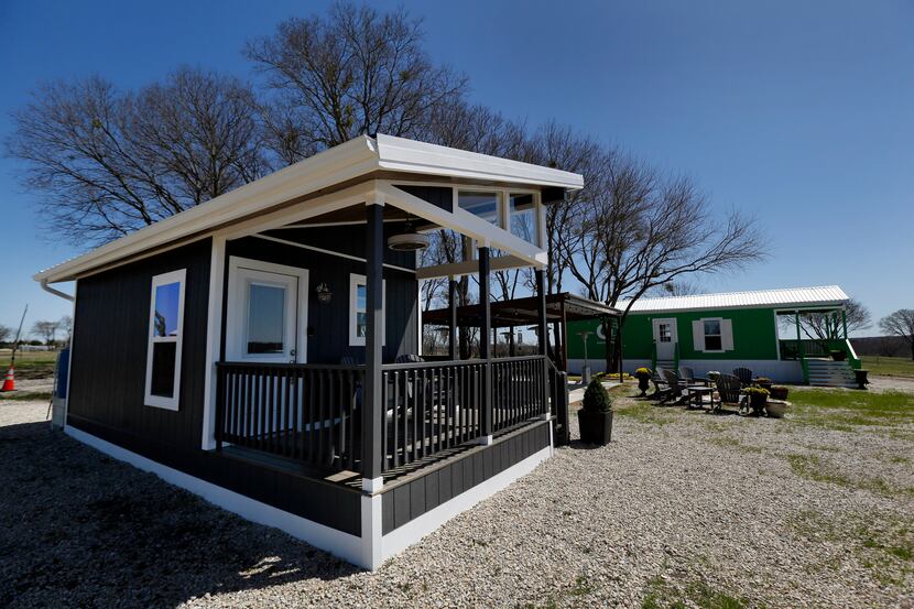 An exterior view of tiny house models at OurCommunity, which is under construction in rural...