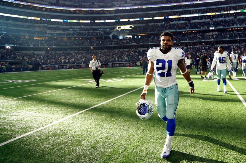 FILE - Dallas Cowboys running back Ezekiel Elliott (21) walks to the locker room following...