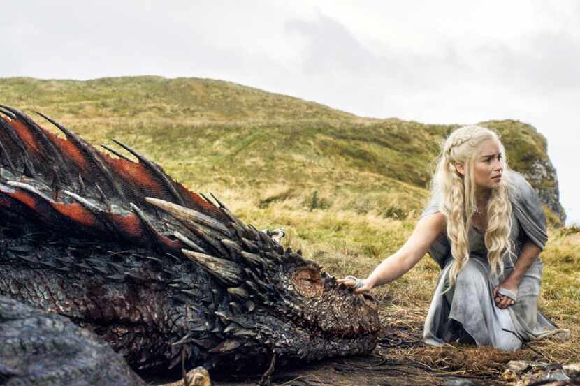 In this file image released by HBO, Emilia Clarke appears in a scene from "Game of Thrones,"...
