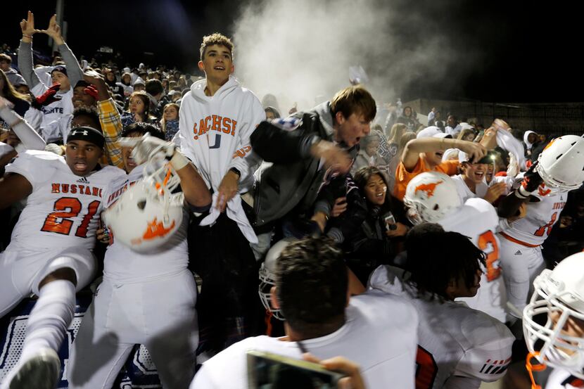 Sachse fans and players celebrate in the stands at the end of the team's 48-0 win over...