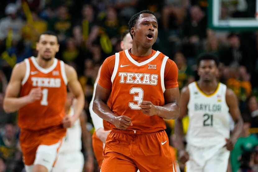 Texas's Max Abmas reacts after scoring a basket against Baylor during the first half of an...