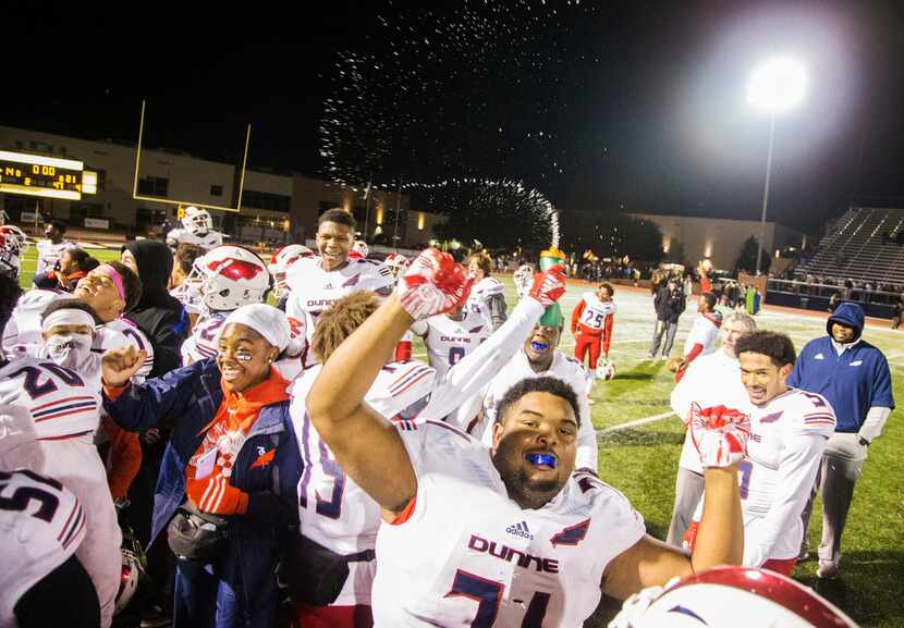 Bishop Dunne Catholic School players celebrate after winning the game against Prestonwood...