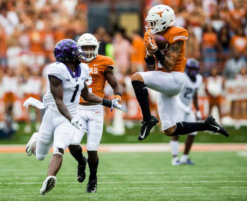 Texas Longhorns defensive back Caden Sterns (7) intercepts a pass intended for TCU Horned...