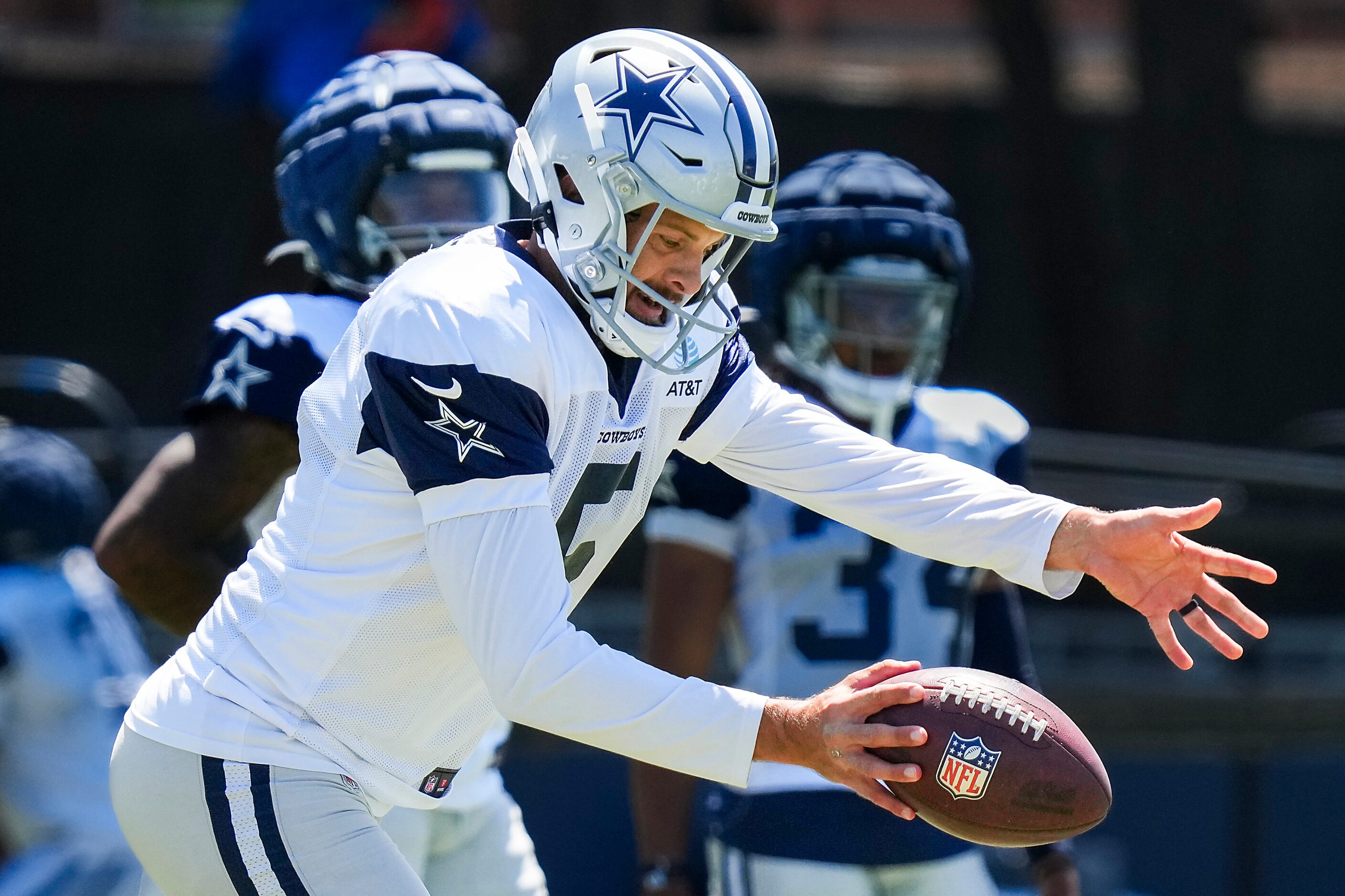 Dallas Cowboys punter Bryan Anger participates in a drill during a training camp practice on...