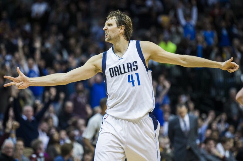 Dallas Mavericks forward Dirk Nowitzki (41) celebrates scoring a three pointer in overtime...