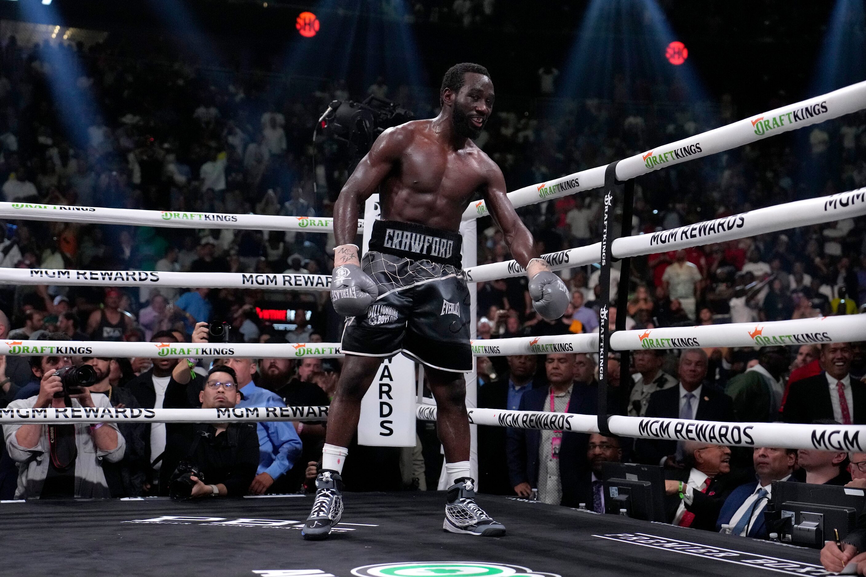 Terence Crawford stands in his corner after knocking down Errol Spence Jr. during their...