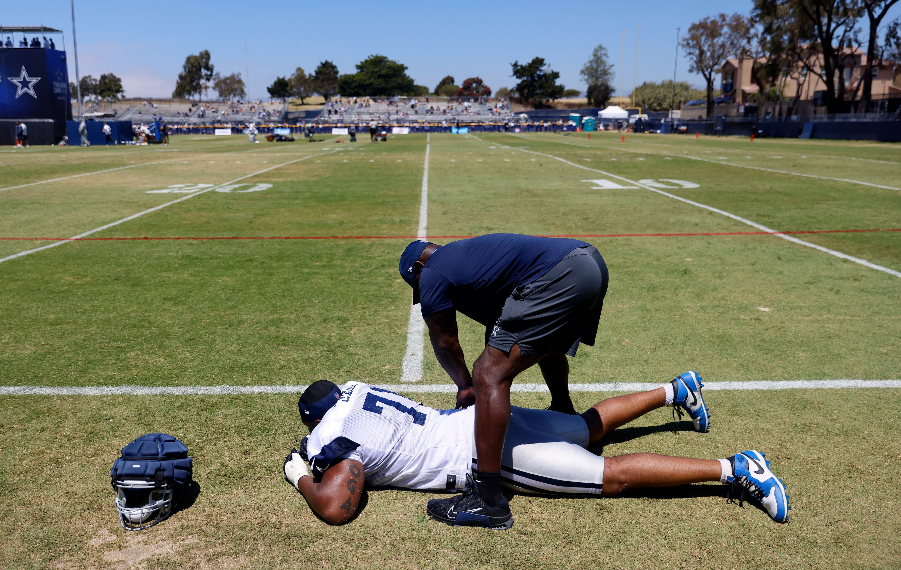 Dallas Cowboys guard Chuma Edoga (71) has soreness worked out on the sideline during...