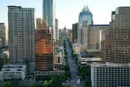 Aerial view of downtown Austin including the Texas State Capitol up Congress Ave. as seen on...