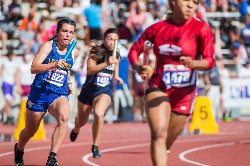 Runners compete in the Girls 5A 4x100 Meter Relay during the 2018 UIL State Track & Field...