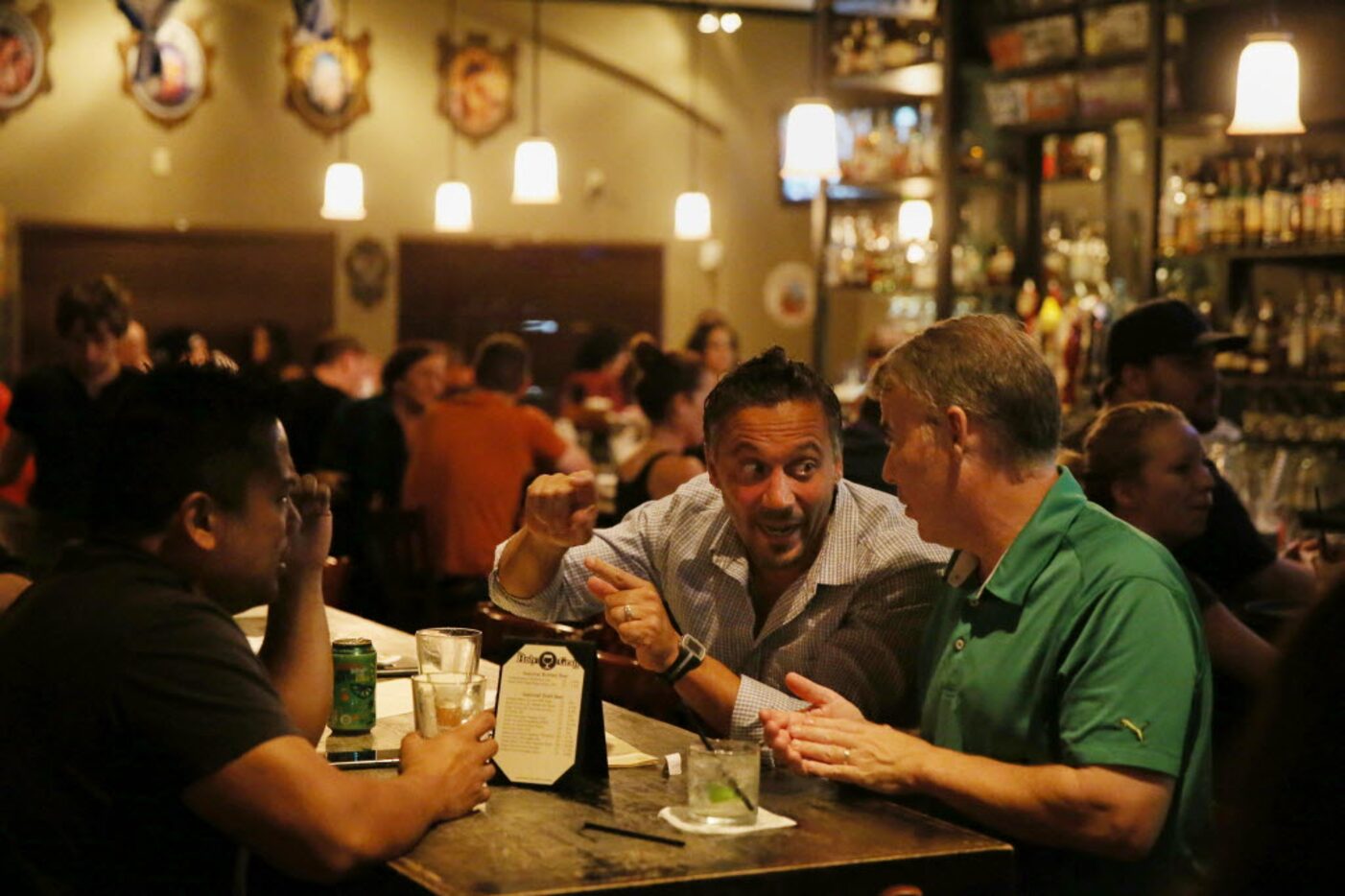 (From left) Alden Raymundo, of Lewisville, Texas, Felix Lima, of Austin, and Richard Marr,...