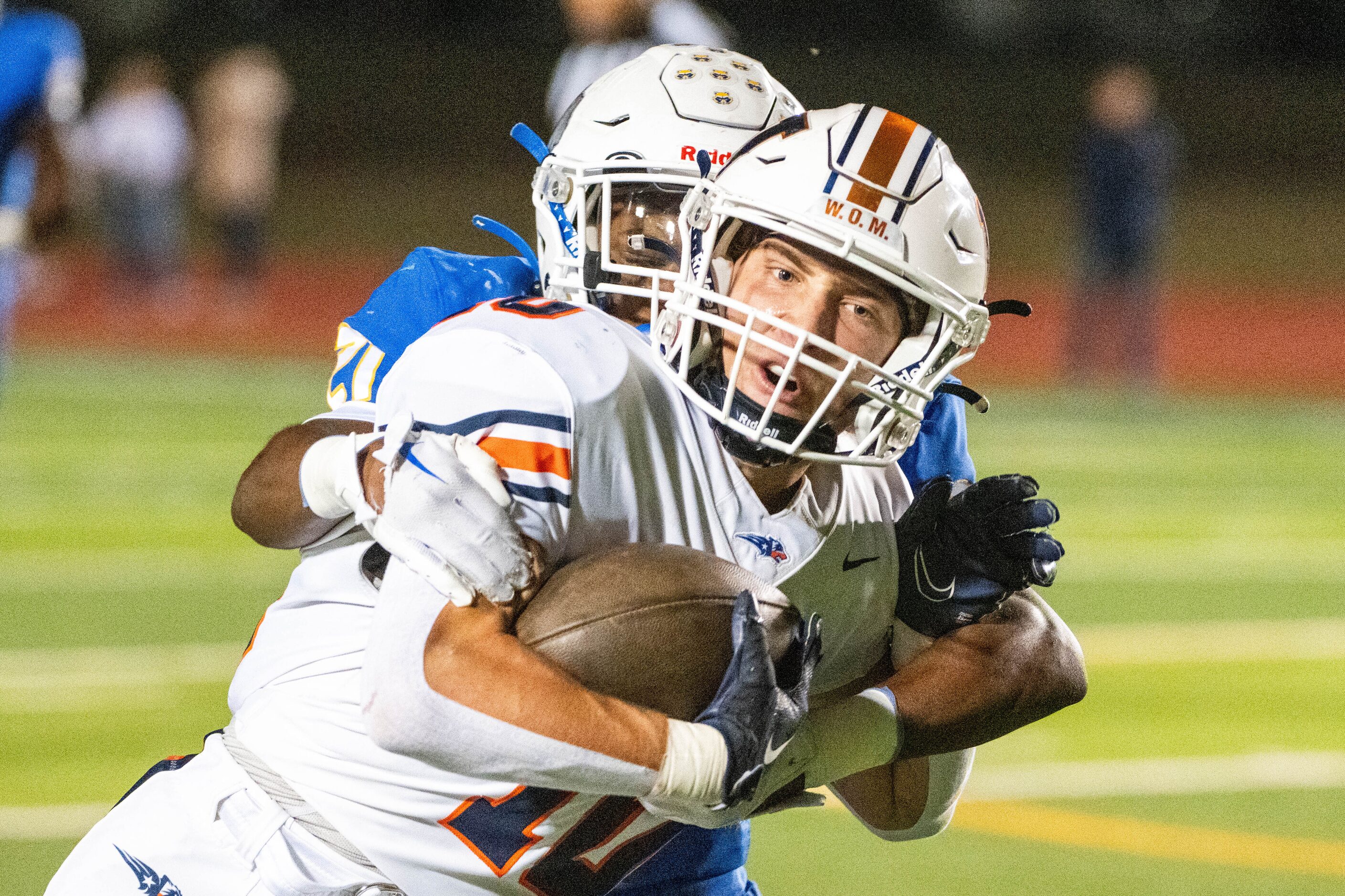 Wakeland's Grayson Myer runs through a tackle attempt by Frisco's LJ Taylor in the first...