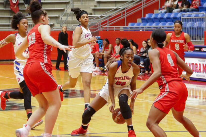 McDonald's All-American Zarielle Green (00) of Duncanville dribbles against Irving...