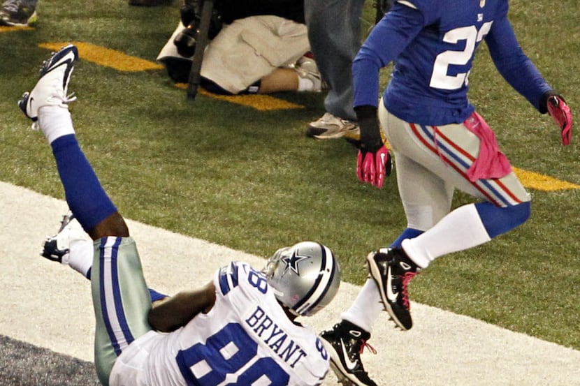 Dallas Cowboys wide receiver Dez Bryant (88) lands out of bounds on a near touchdown pass as...