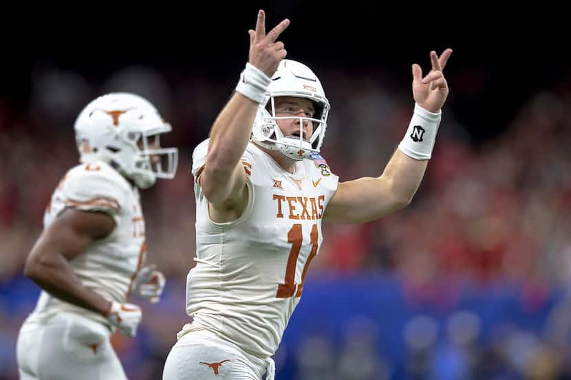 Texas quarterback Sam Ehlinger (11) celebrates one of his touchdowns against Georgia during...