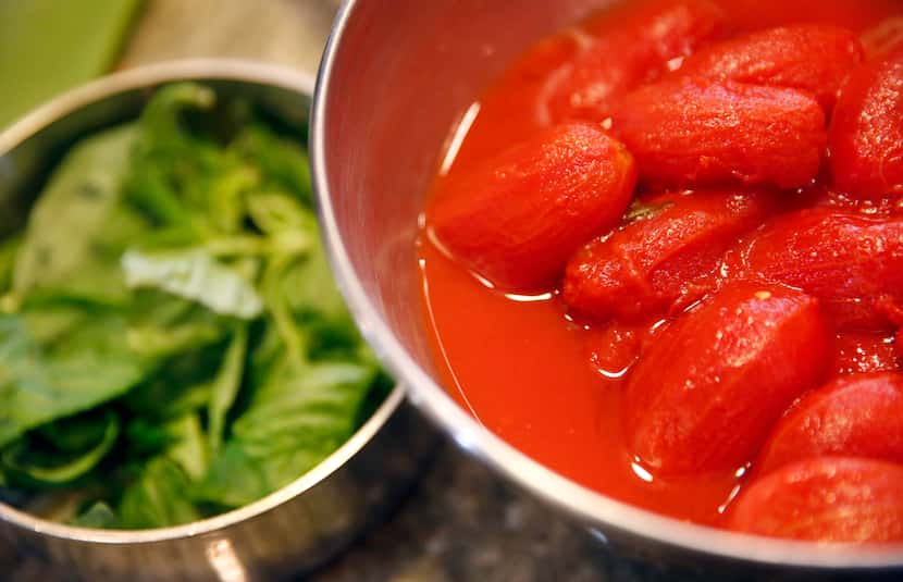 Restaurant owner and chef Julian Barsotti uses 52 oz. of canned whole tomatoes for his...