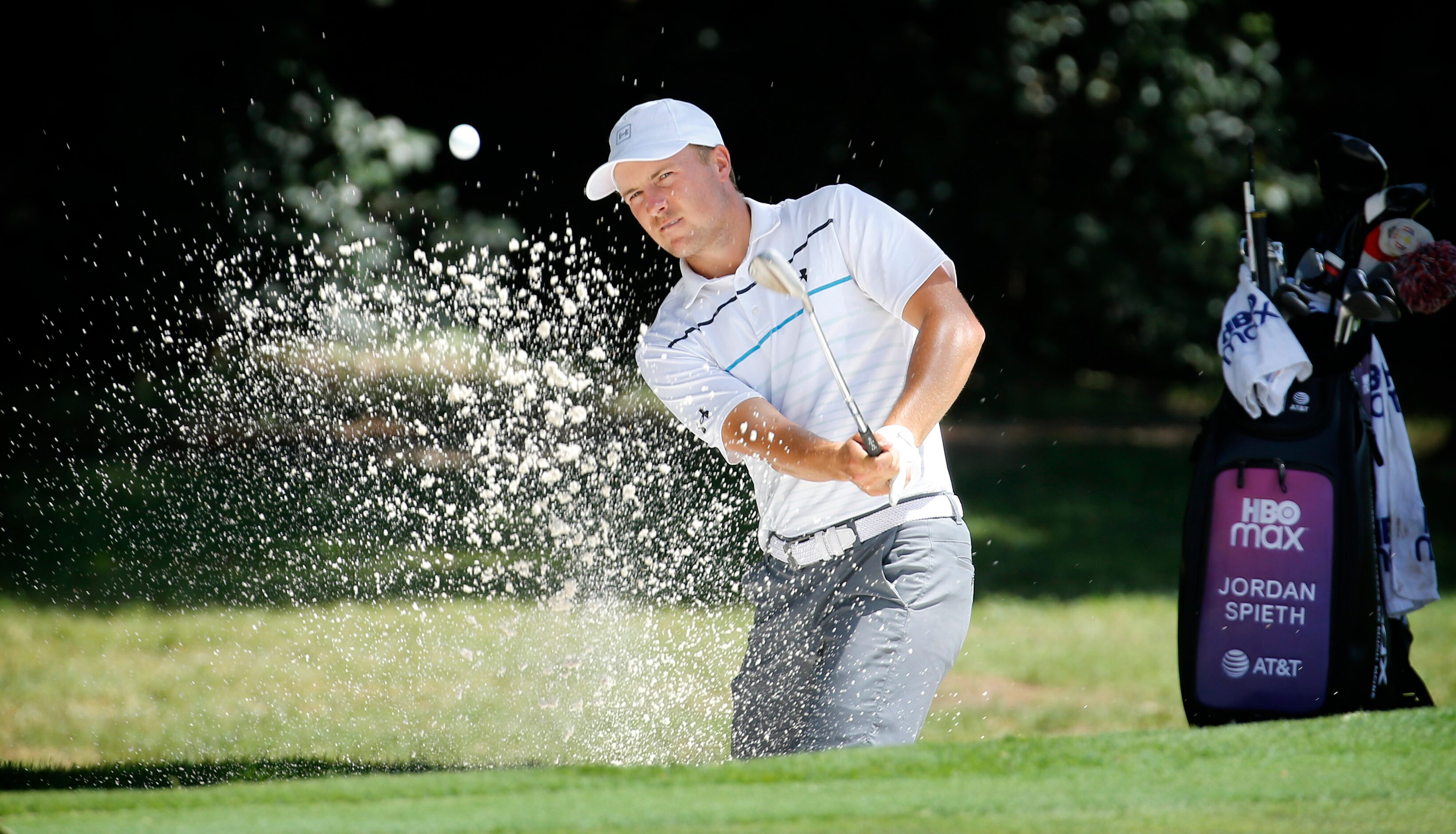 PGA golfer Jordan Spieth practices out of the No. 8 green side bunker during the Charles...