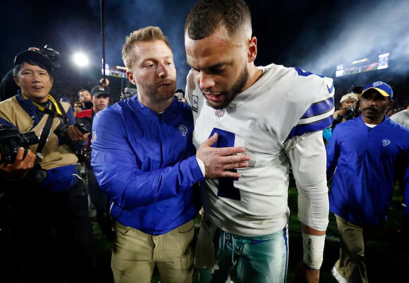 Dallas Cowboys quarterback Dak Prescott (4) is comforted by Los Angeles Rams head coach Sean...
