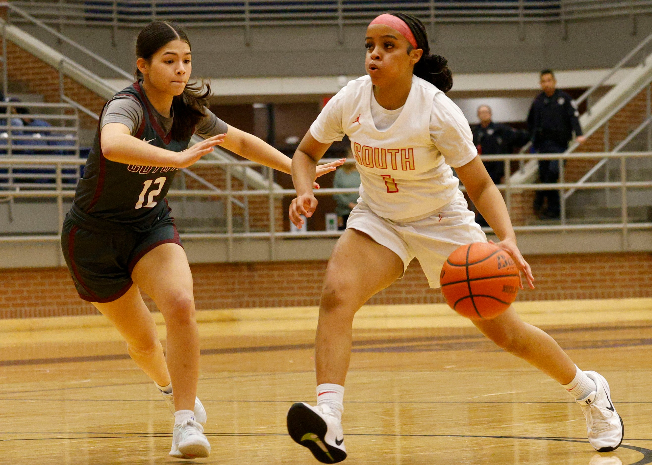 South Grand Prairie's Spirit Sheriff (1) keeps the ball away from Frisco Heritage's Andrea...