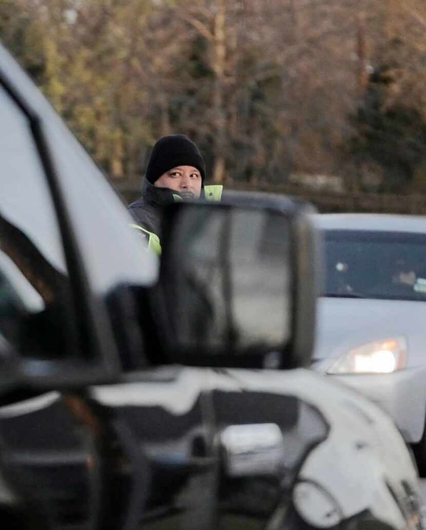 
Dallas County Sheriff Deputy M. Chavez keeps an eye on northbound morning traffic in...