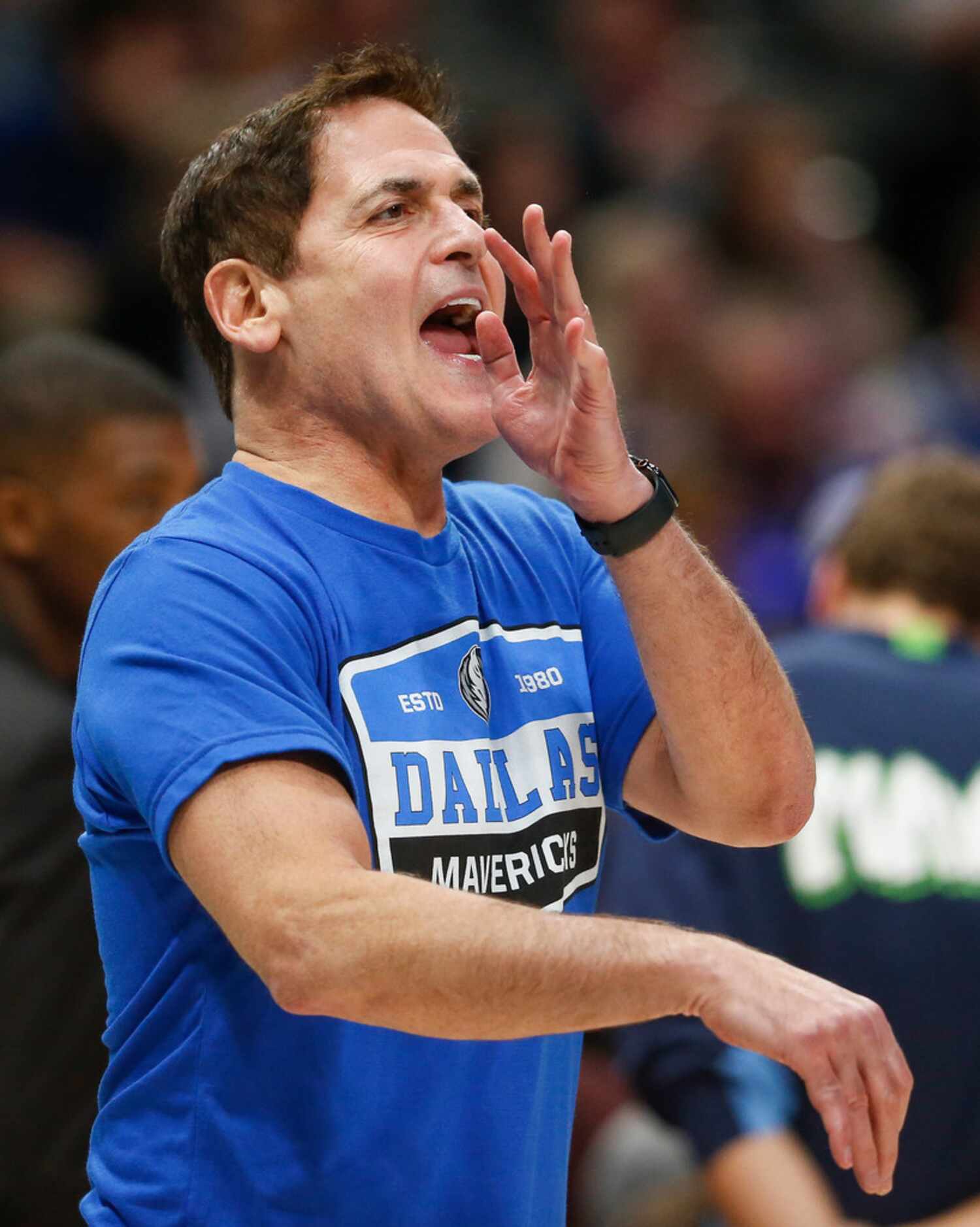 Dallas Mavericks owner Mark Cuban disputes an official's call during the second half of a...