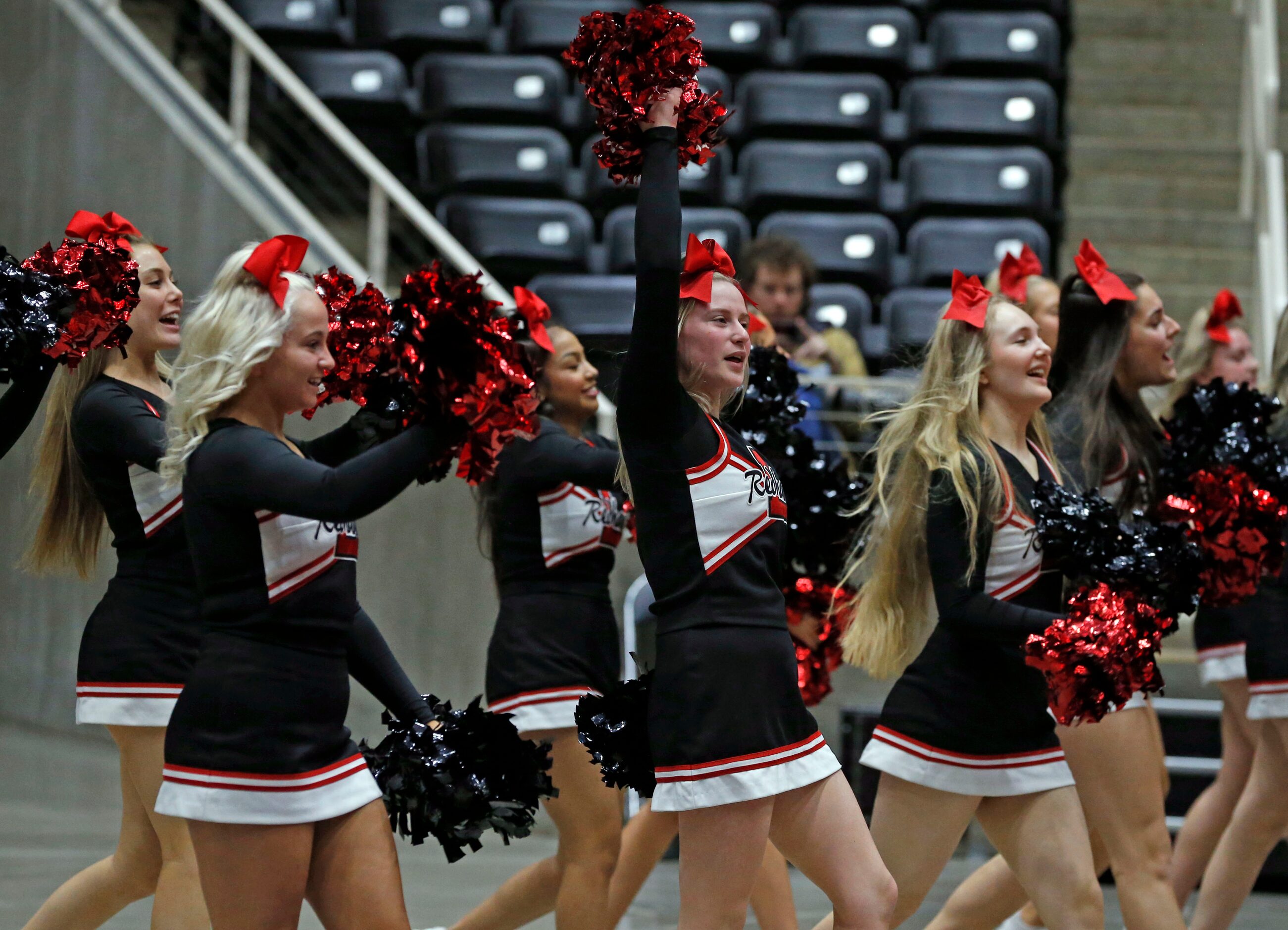 The Frisco Liberty cheerleaders yell during a break in the action during the Class 5A State...