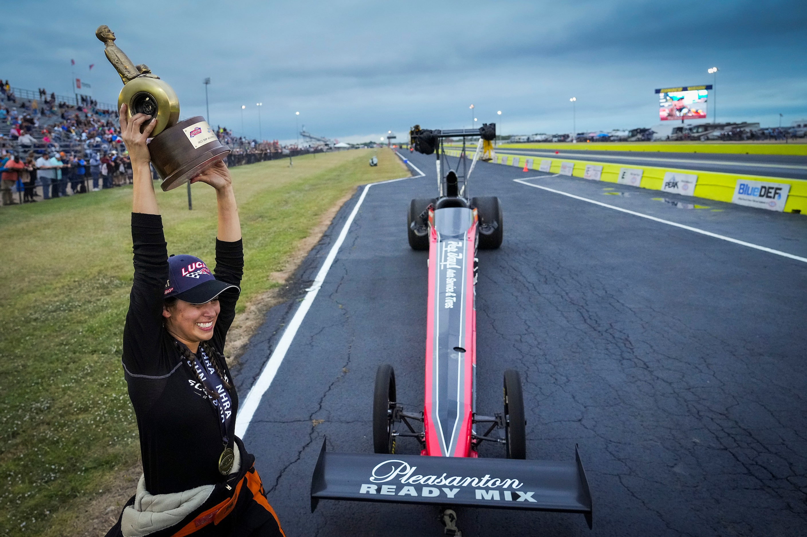 Jasmine Salinas	celebrates her Top Alcohol Dragster victory at the Texas NHRA FallNationals...