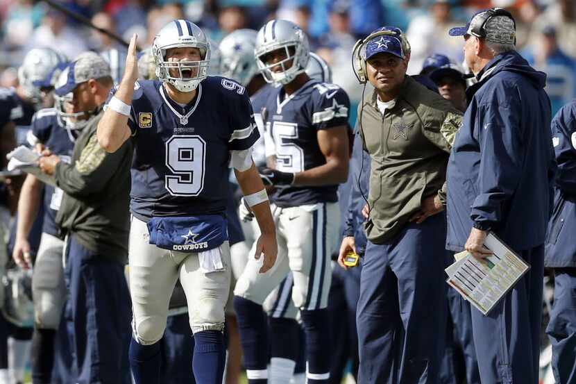 Dallas Cowboys quarterback Tony Romo yells at players coming on the bench during the first...