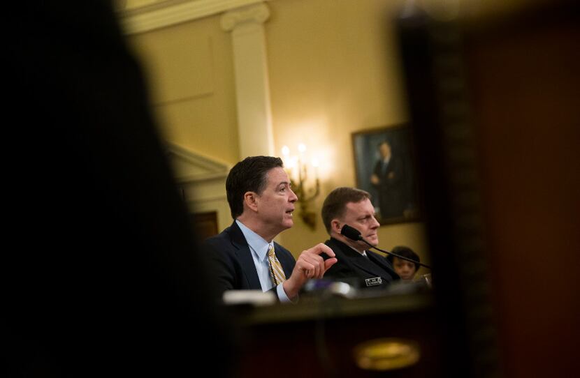 FBI Director James Comey (left) and Adm. Michael Rogers, director of the National Security...