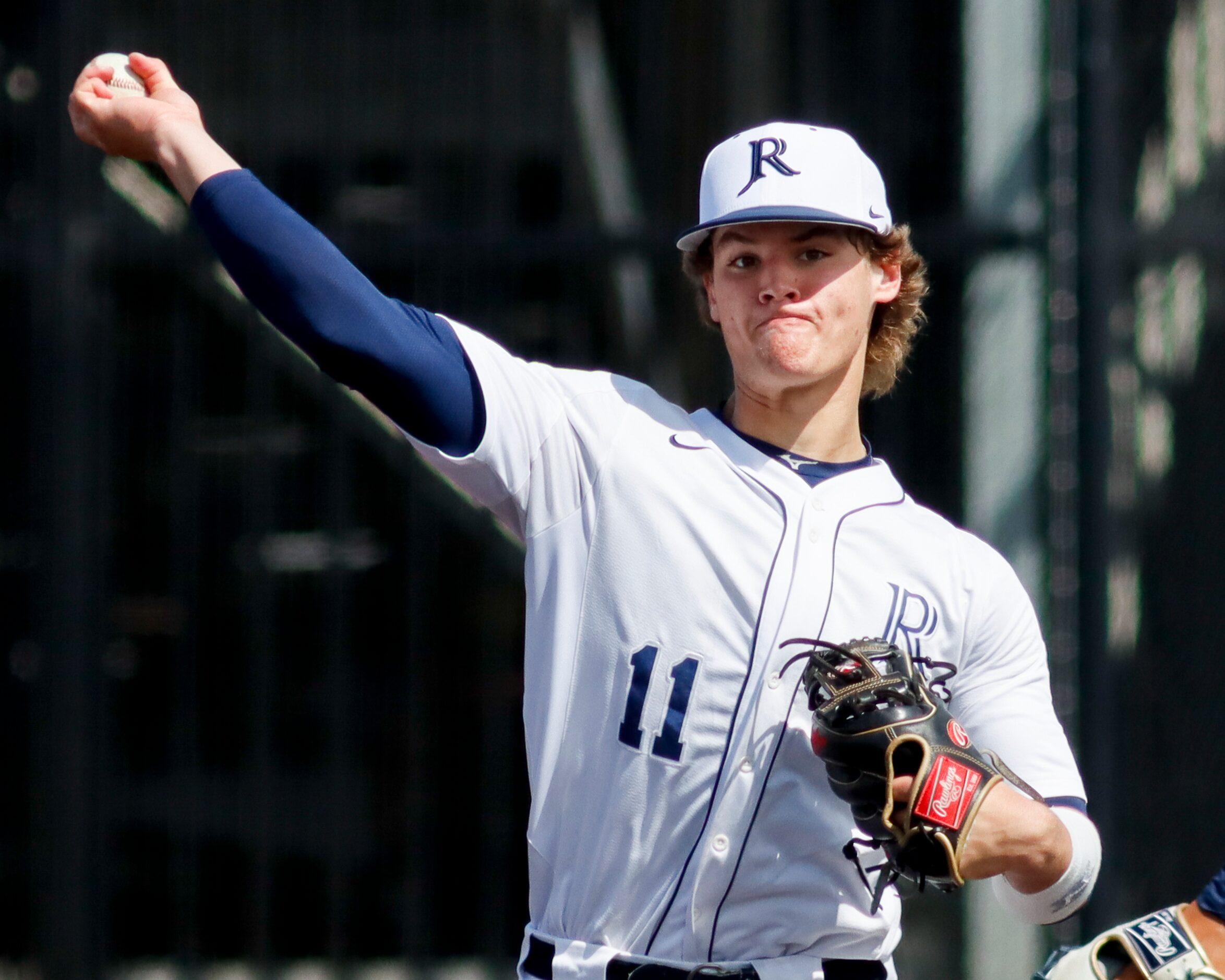 Jesuit third baseman Drew Messick throws to first during a district 7-6A game against...