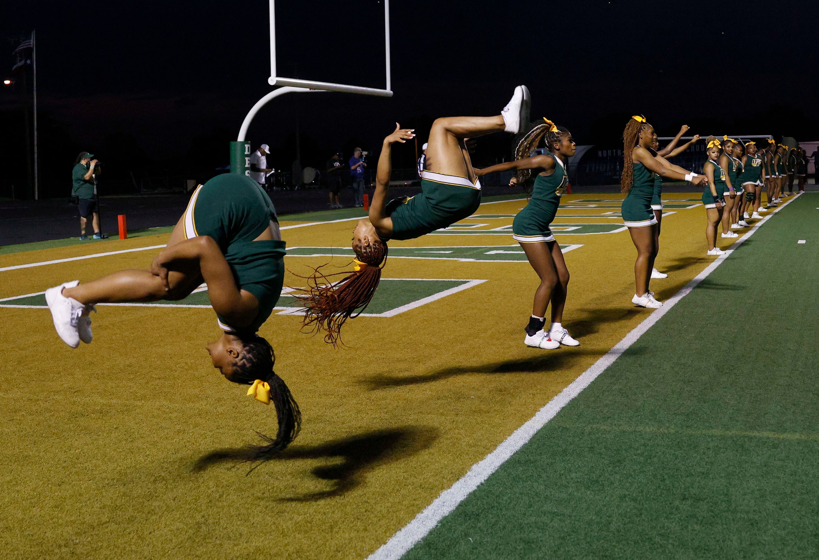 DeSoto’s cheerleaders perform during the first half of a high school football game against...