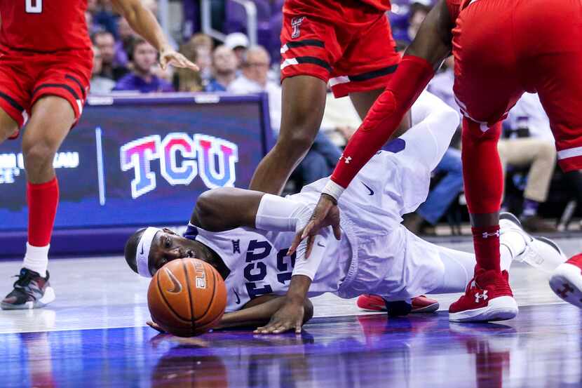 TCU Horned Frogs forward Kouat Noi (12) goes down after losing the ball during an NCAA...