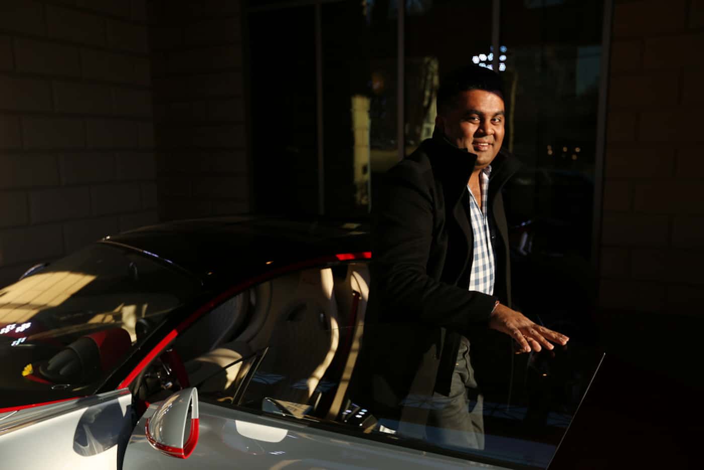 Vehicle owner Mayur Shree arrives before an event put on by Park Place commemorating the...