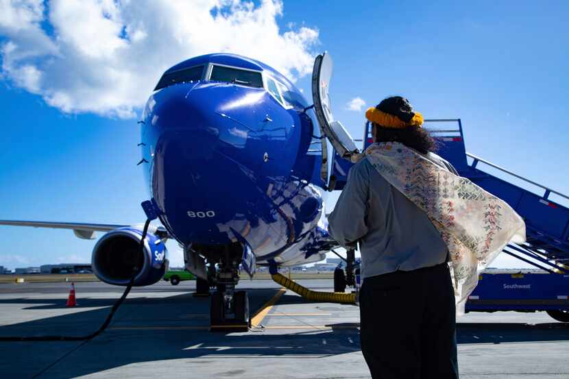 A Hawaiian elder welcomes Southwest Airlines' first ever flight to the Hawaiian Islands with...