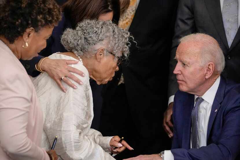 Opal Lee, known as the Grandmother of Juneteenth, speaks with U.S. President Joe Biden after...