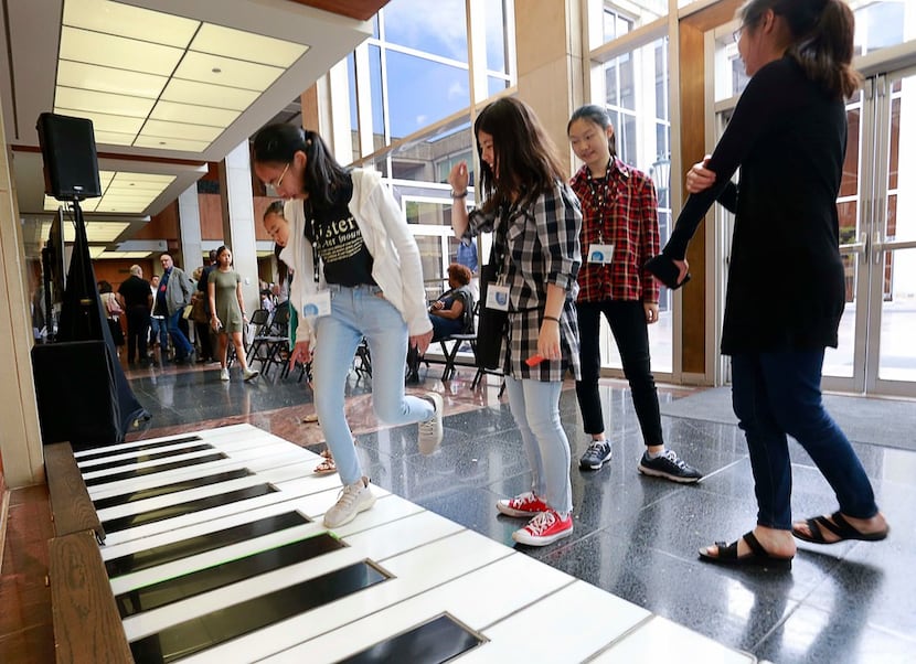 Contestants and participants play on the Cliburn electronic piano during the quarterfinal...