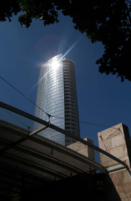 Light reflects off Museum Tower as seen from the Nasher Sculpture Center (bottom) in Dallas,...