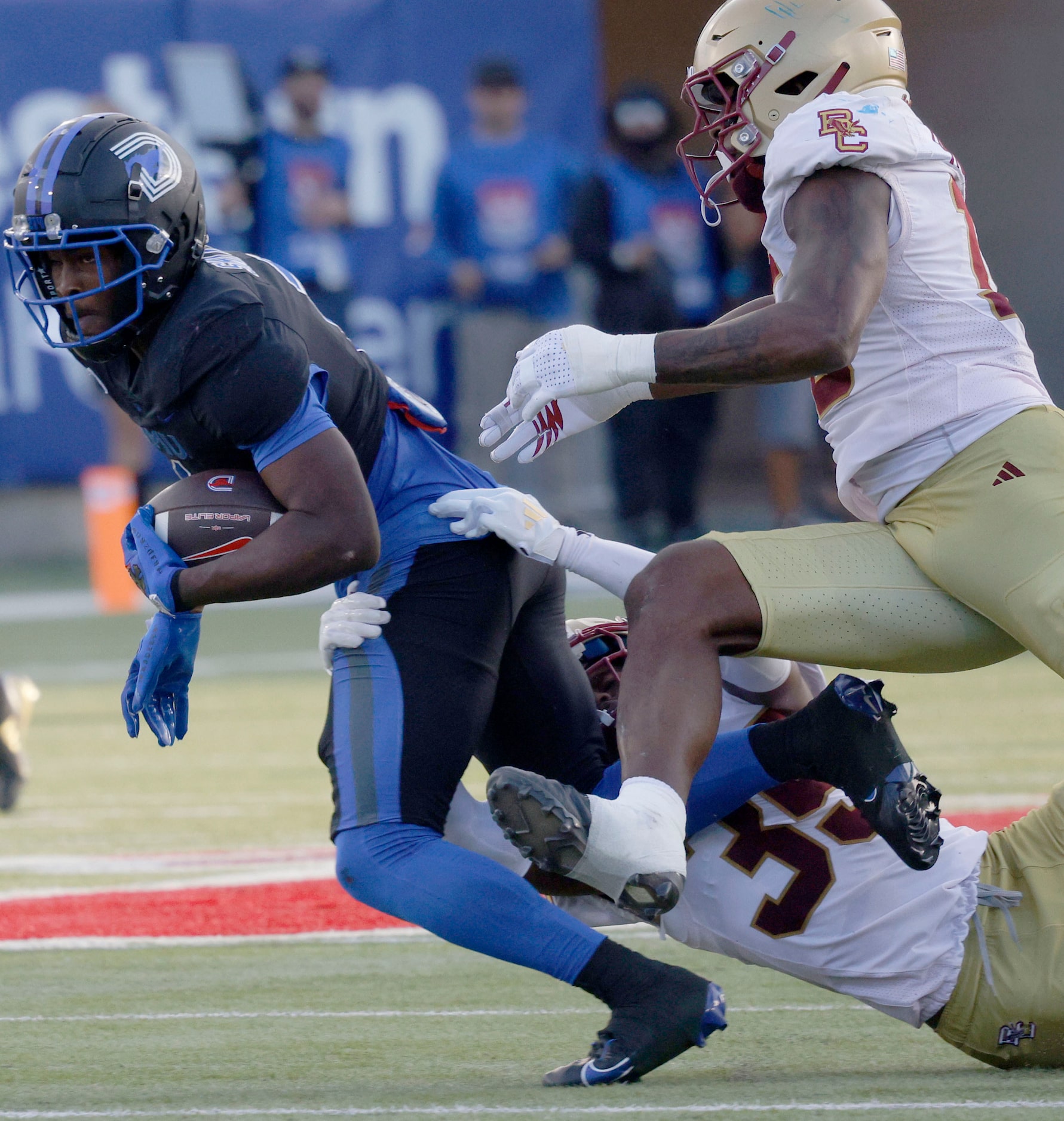 SMU running back Brashard Smith (1) is tackled by Boston College defensive back Ashton...