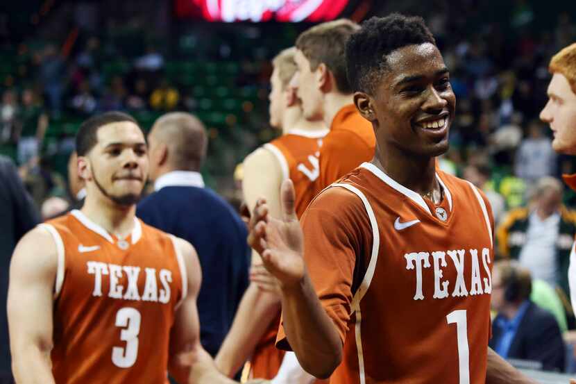 Texas  guard Isaiah Taylor (1) celebrates with teammates after the Longhorns' 74-60 victory...