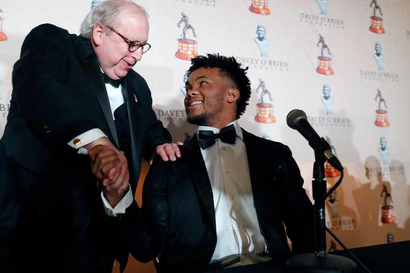 Heisman Trophy winner quarterback Kyler Murray, right, shakes hands with David O'Brien Jr....