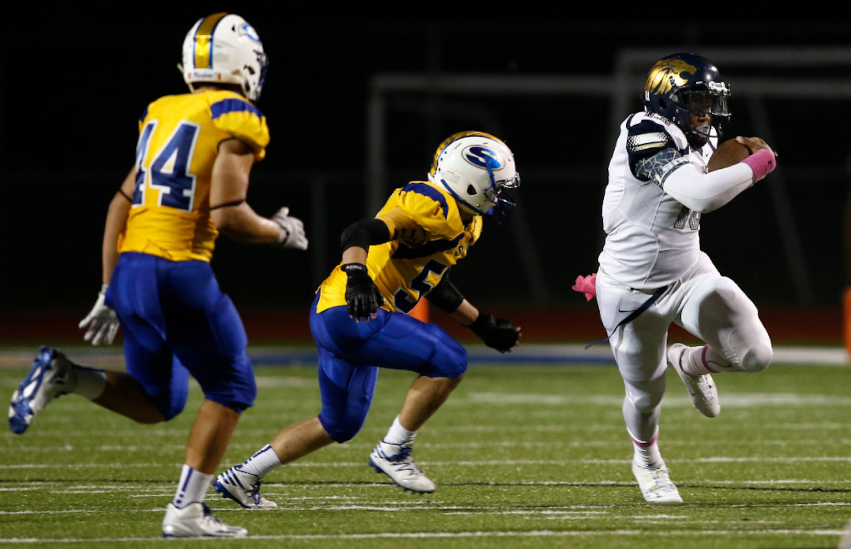 Life Oak Cliff quarterback Chayce Harris (13) carries the ball as Sunnyvale defensive...