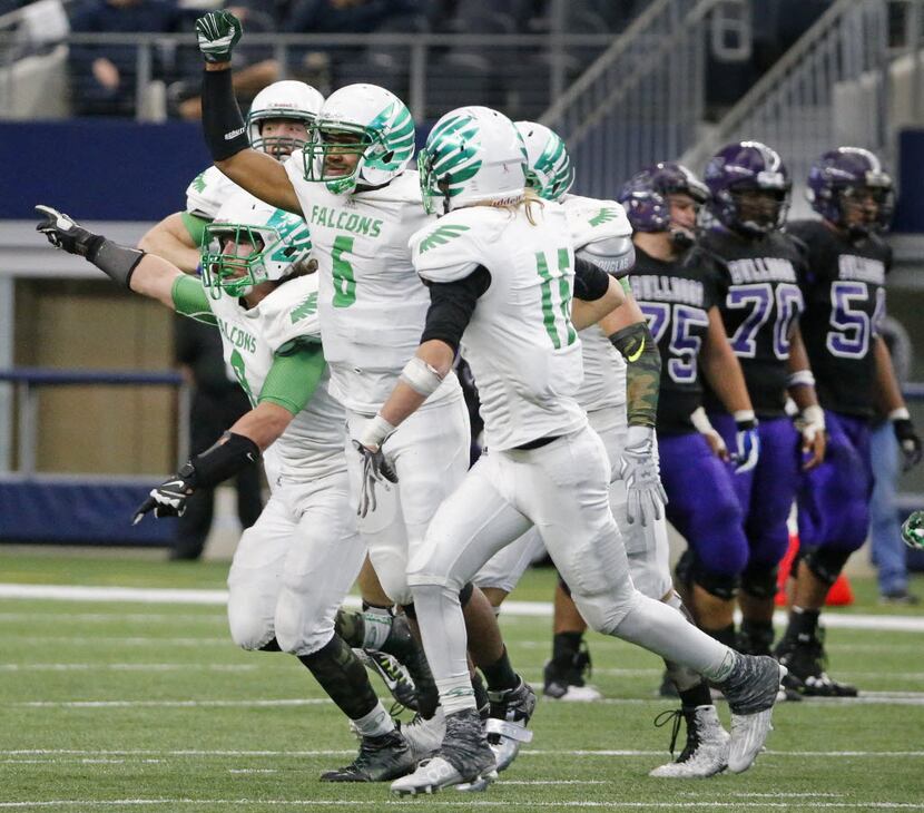 The Lake Dallas defense celebrates recovering an Everman fumble in the second half during...