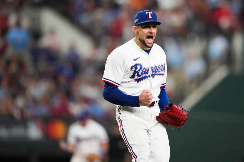 Texas Rangers starting pitcher Nathan Eovaldi celebrates after striking out the Baltimore...