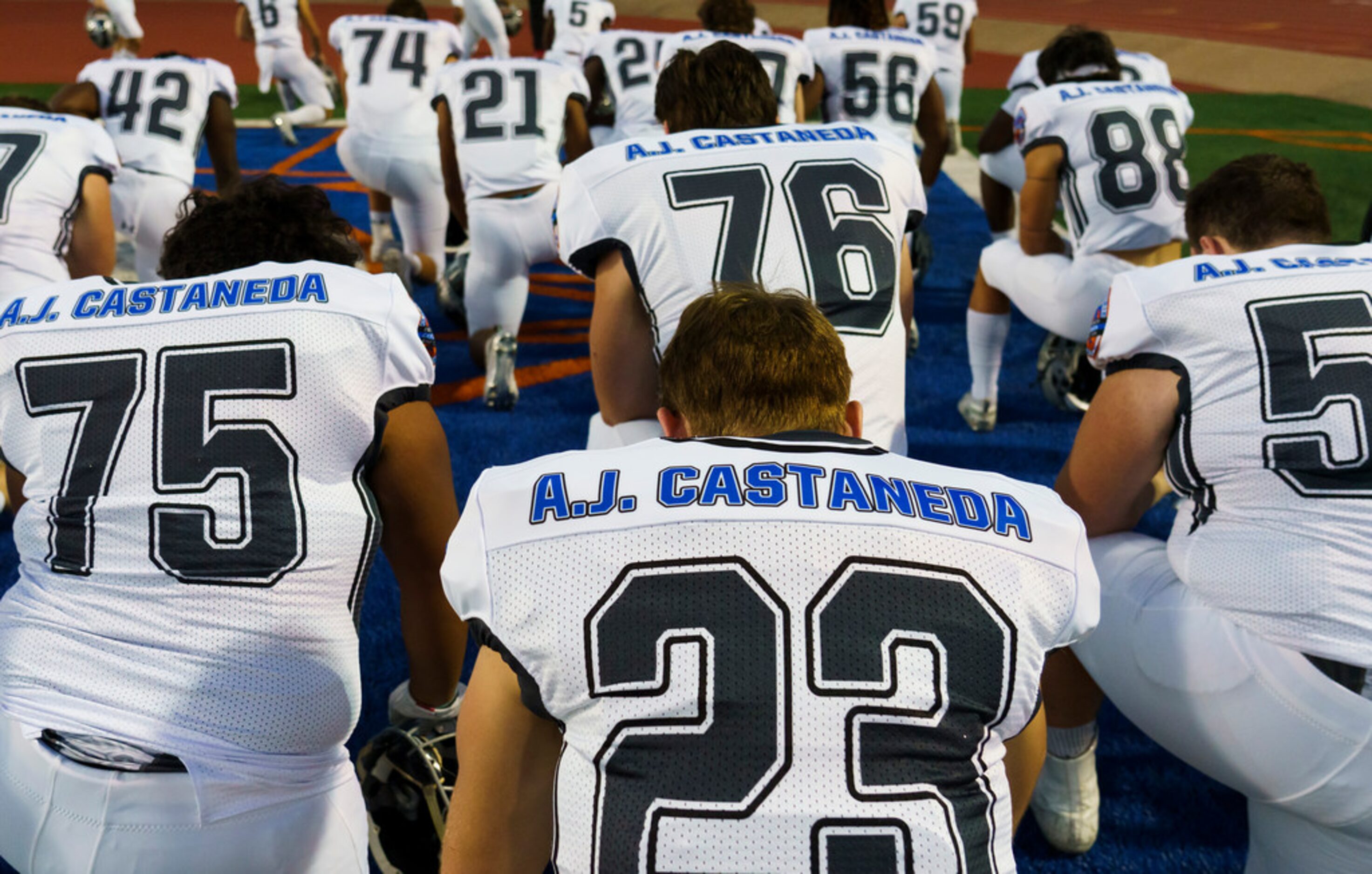 Arlington Martin players wear jerseys honoring Grand Prairie police officer A.J. Castaneda,...