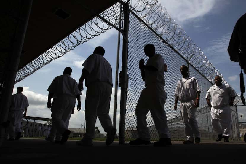 Inmates walking to the Chow Hall at the L.V. Hightower Unit in Dayton, Texas on July 16,...